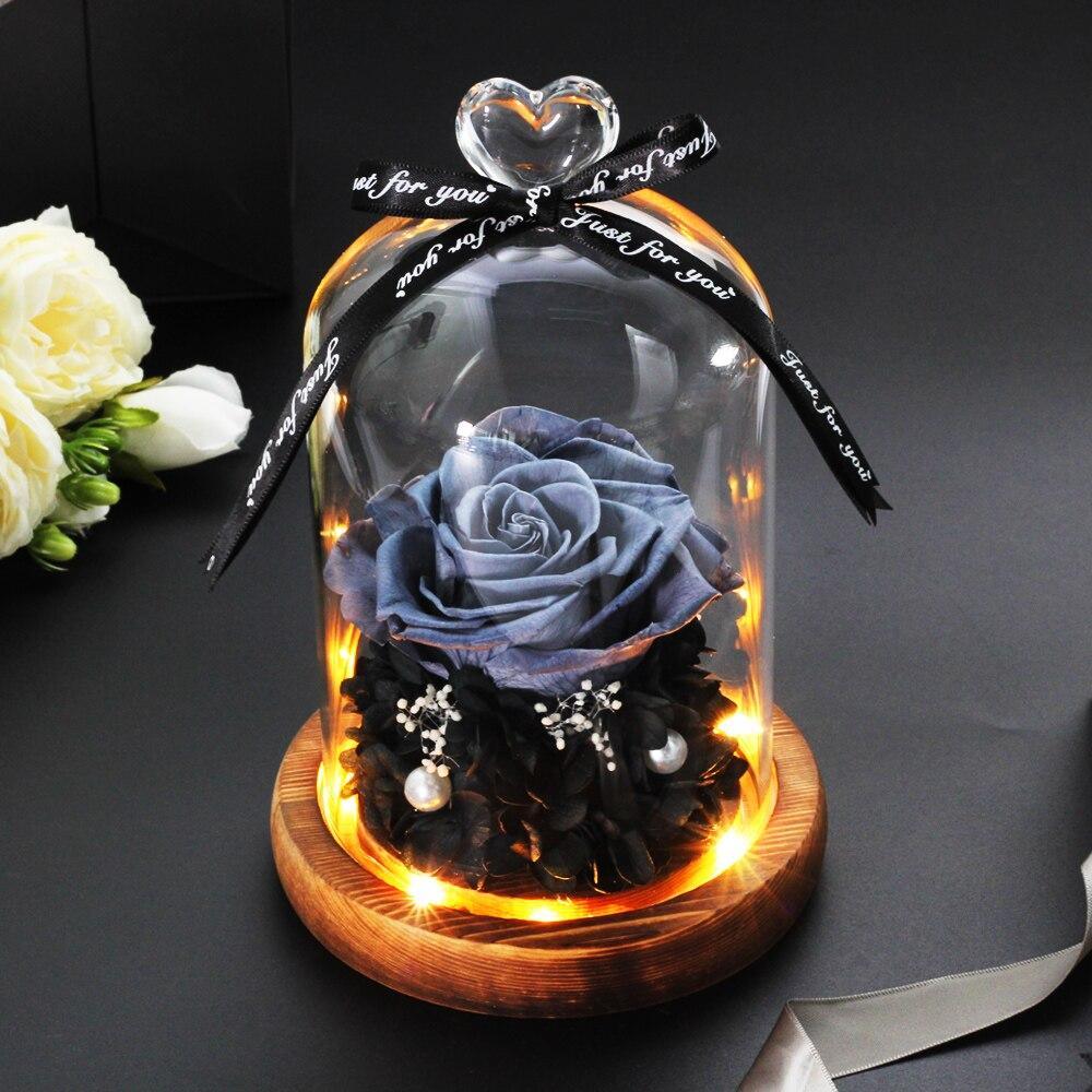Beautiful Eternal Rose under glass dome glowing
